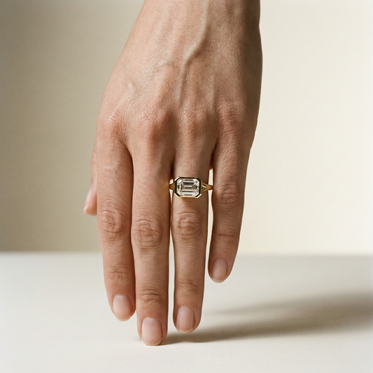 EAST WEST EMERALD SOLITAIRE